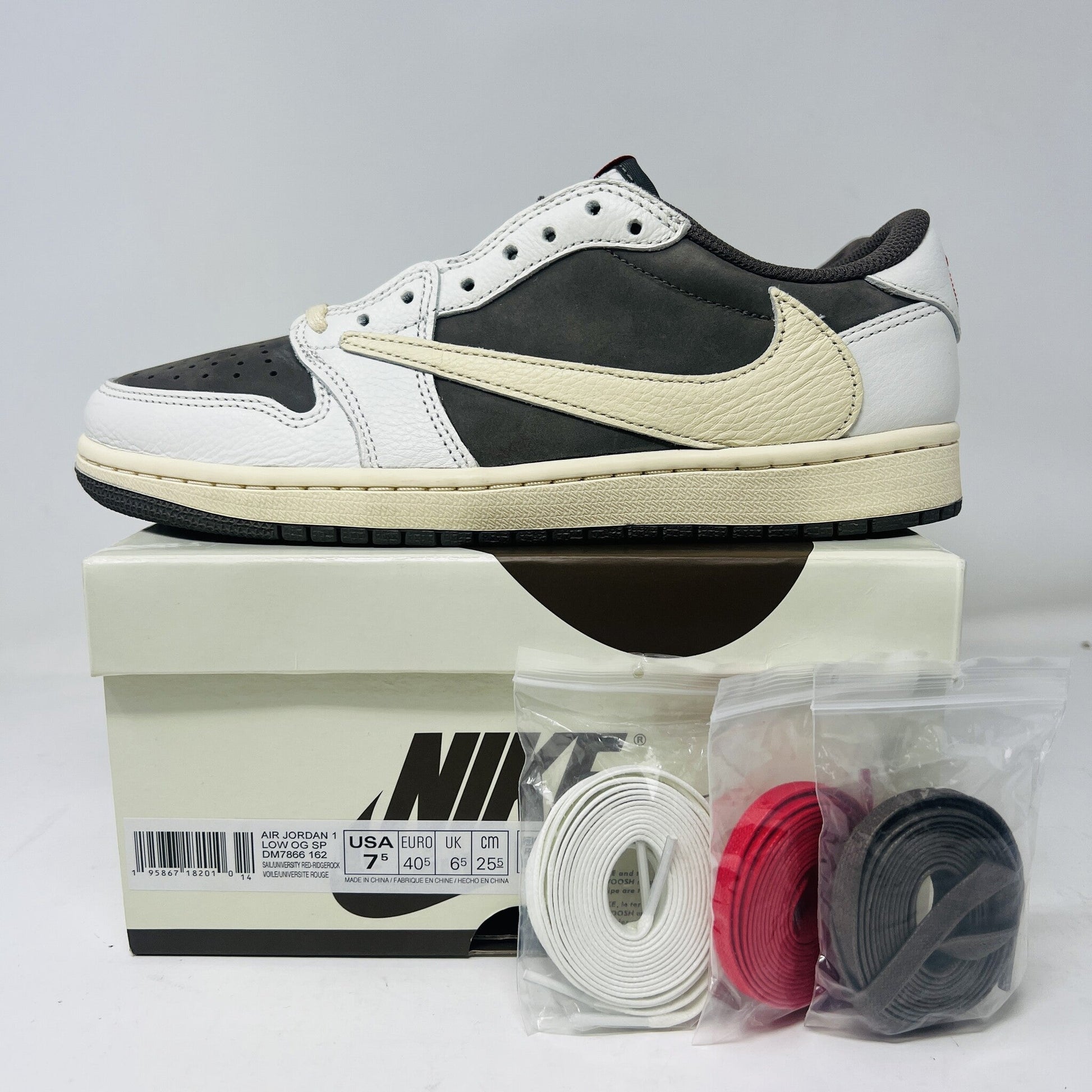 Jordan 1 Retro Low OG SP Travis Scott Reverse Mocha sneakers with box, size 7.5M, includes white, brown, red laces.