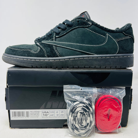 Displayed on the box, the Jordan 1 Retro Low OG SP Travis Scott Black Phantom sneaker, with a clean design and white stitching, boasts the iconic swoosh. In front are two sets of extra laces—one red and one black/white patterned. The box details size and brand, indicating general wear durability.