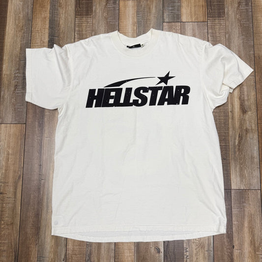 The Hellstar Classic T-shirt from HELL STAR is a white tee with a black HELSTAR logo featuring a star design in the text, showcased on a wooden floor.