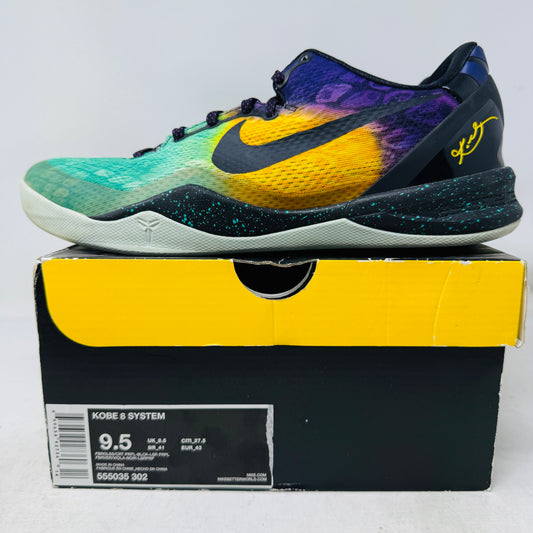 A vibrant Nike Kobe 8 Easter sneaker in teal, purple, and yellow sits on a black and yellow box labeled Kobe 8 System with size 9.5. It has clean uppers, a black Nike swoosh, and is certified 100% authentic.