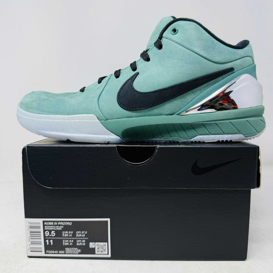 Green Nike Kobe 4 Protro Girl Dad basketball shoe with a black swoosh, silver heel accent, and suede finish sits atop a Nike shoebox. In 9/10 condition and worn once, the label indicates size 9.5 US with additional sizing details for these authentic shoes.