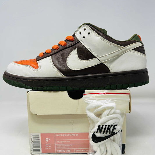 Nike SB Dunk Low Oompa Loompa sneaker with brown, white, and orange design, includes box and white laces.