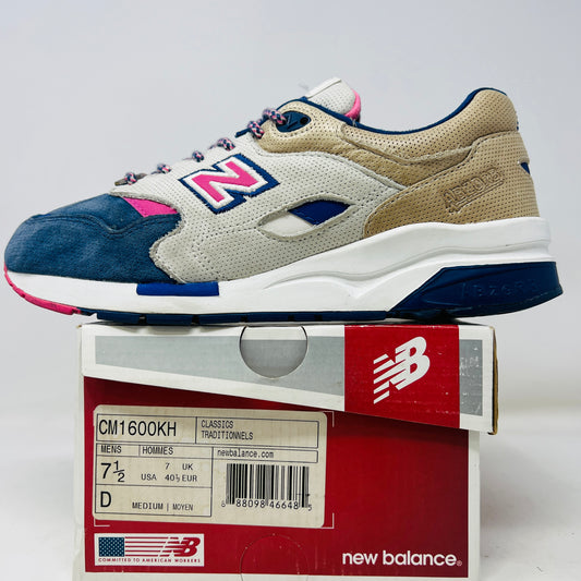 The New Balance 1600 Ronnie Fieg Daytona sneaker features clean uppers with a multicolored design in deep blue, beige, pink, and white. These authentic shoes come in their original red and white box, showcasing product details and branding.