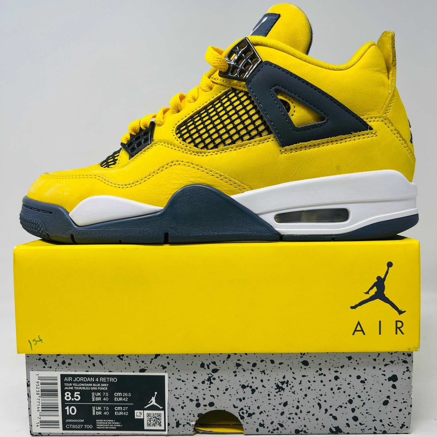 Jordan 4 Retro Lightning (2021) sneaker in yellow and black with original box.