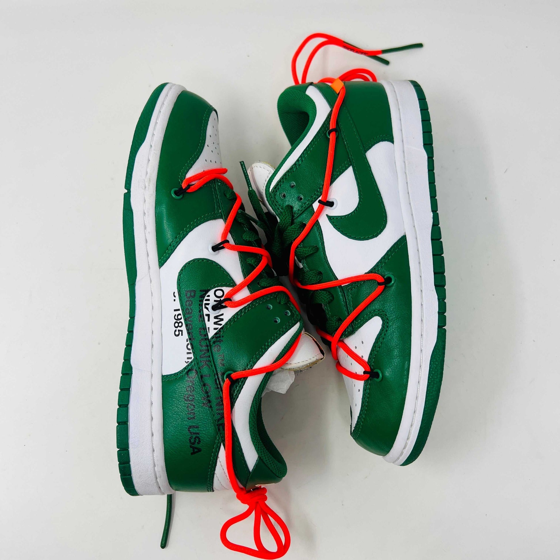 Nike Dunk Low Off-White Pine Green sneakers with red laces, lightly used condition.