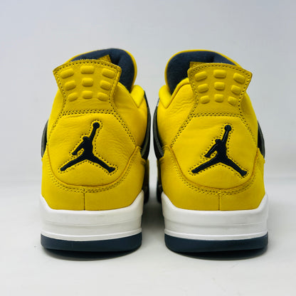 The Jordan 4 Retro Lightning (2021) in yellow, worn once and still pristine with its box, features black accents, a white midsole, and visible air cushioning. Sizes 10.5 and 12 are labeled alongside the Jumpman logo on both the sneaker and matching yellow box.