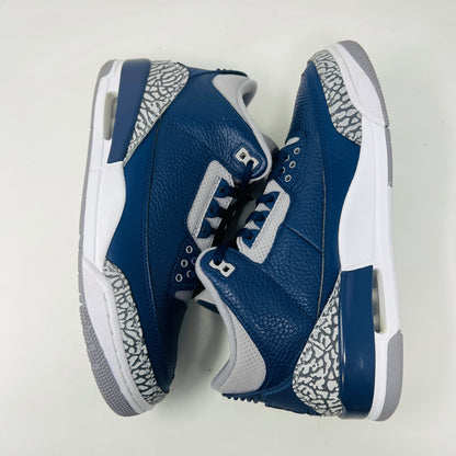 A size 10 Jordan 3 Retro Georgetown (2021) sneaker, in blue and gray with elephant print accents and a white midsole, worn once on its patterned box. The box has minor DMG but matches the sneakers stylish appeal.