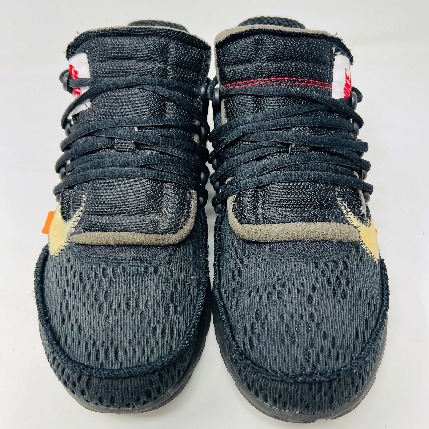 Nike Air Presto Off-White Black 2018 sneakers with orange laces and hang tag on box.