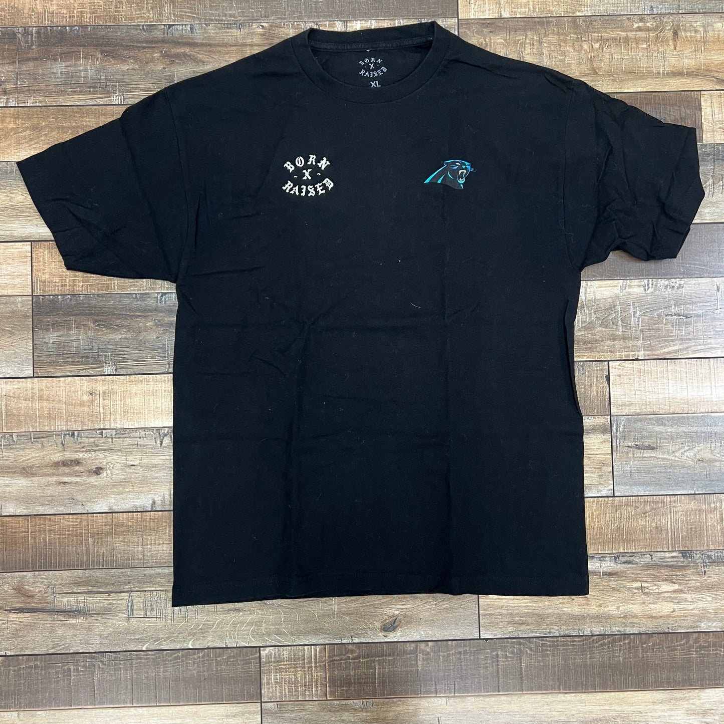 Black Born x Raised Carolina Panthers tee, size XL, preowned.