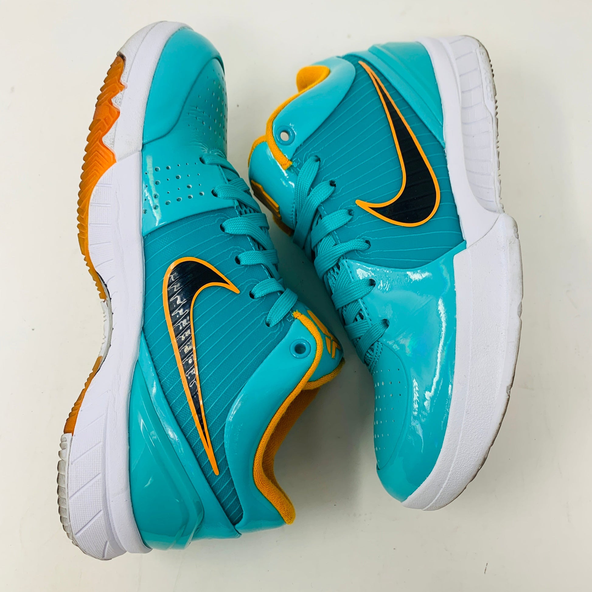 Nike Kobe 4 Protro Undefeated San Antonio Spurs sneakers, turquoise with orange accents, slight toe and midsole creasing, includes orange laces, 2019 release.