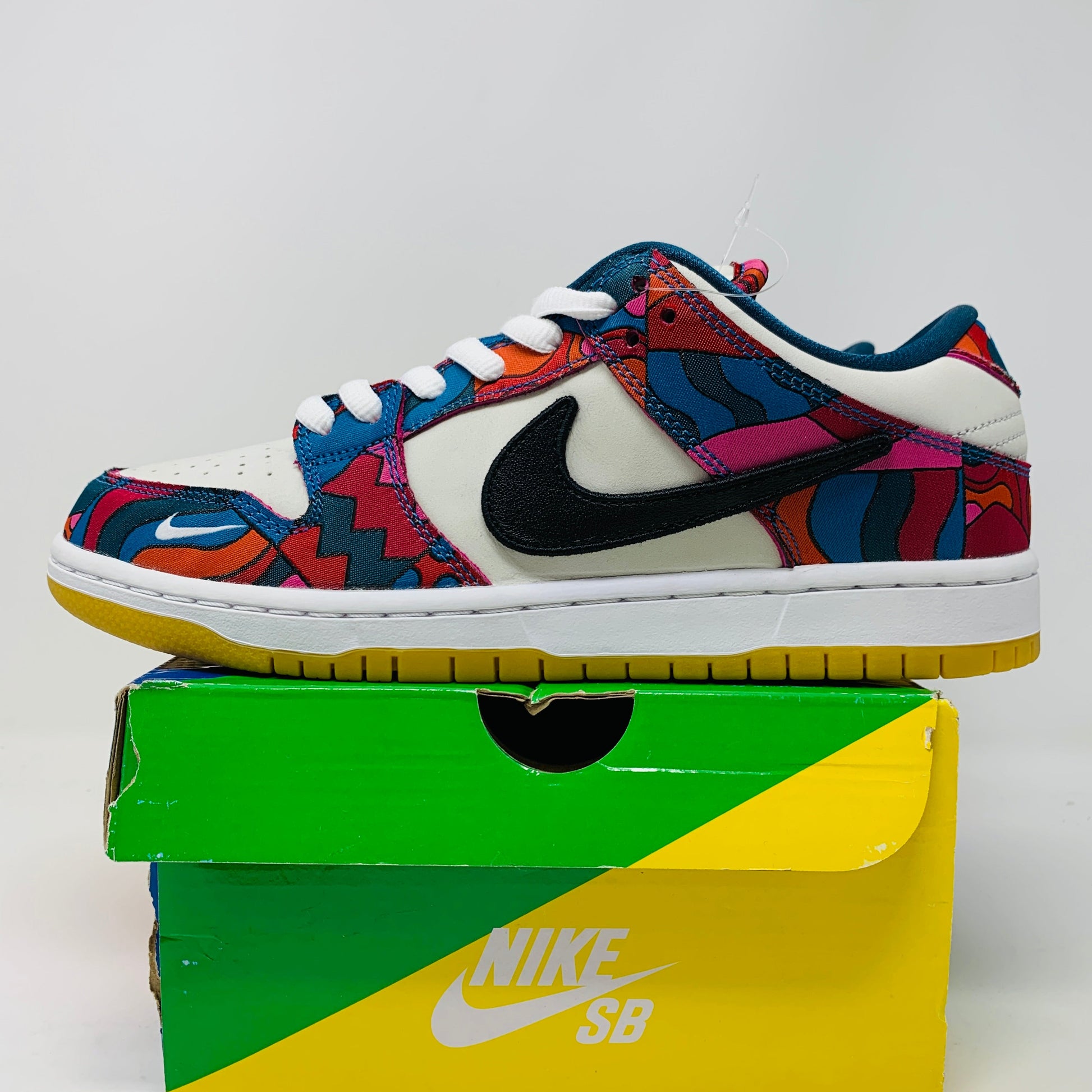 Nike SB Dunk Low Parra sneakers with colorful patterns, brand new condition, extra teal laces, 2021 release.