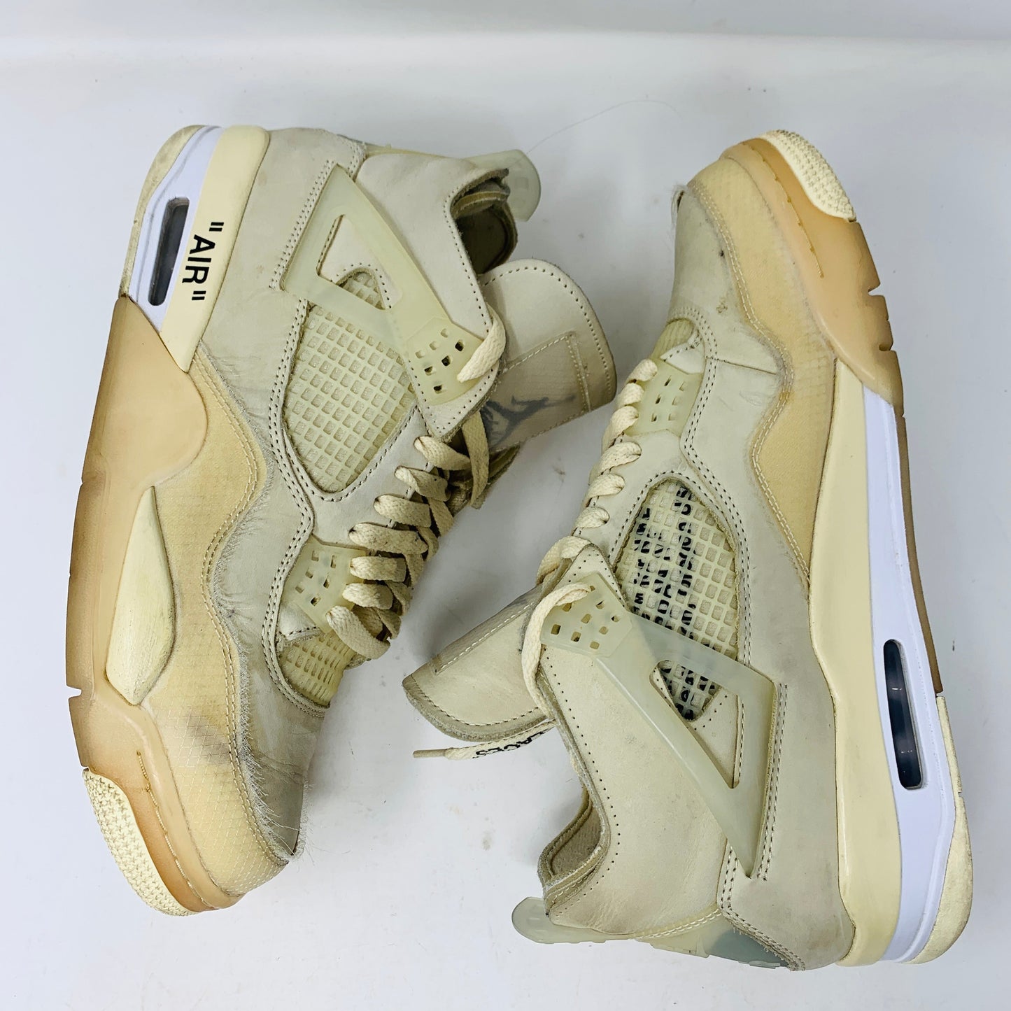 Jordan 4 Retro Off-White Sail sneakers, size 10.5W/9M, 2020 release, pre-owned condition.