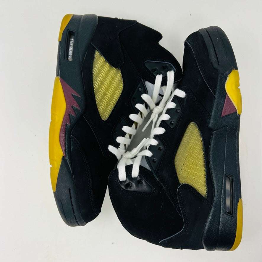 Jordan 5 Retro A Ma Maniére Dusk sneakers from Jordan, featuring yellow and maroon accents, are elegantly positioned side by side on a pristine white background.