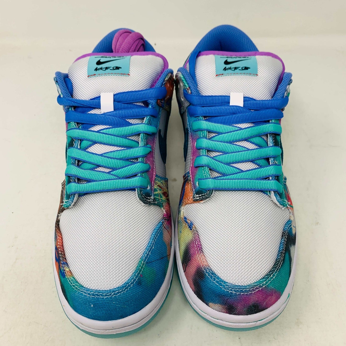 Nike SB Dunk Low Futura Laboratories Bleached Aqua sneaker with vibrant bleached aqua colorway.