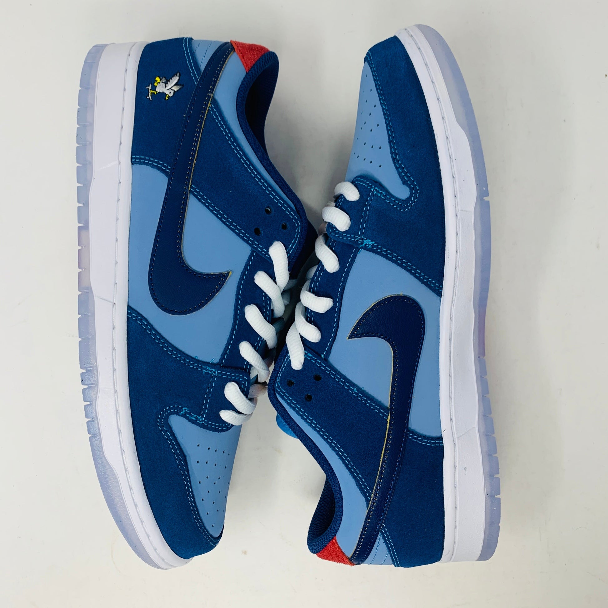 Nike SB Dunk Low "Why So Sad?" sneakers in blue with unique details.