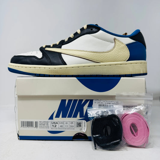 Jordan 1 Retro Low OG SP Fragment x Travis Scott sneaker in black, white, and blue with branding.