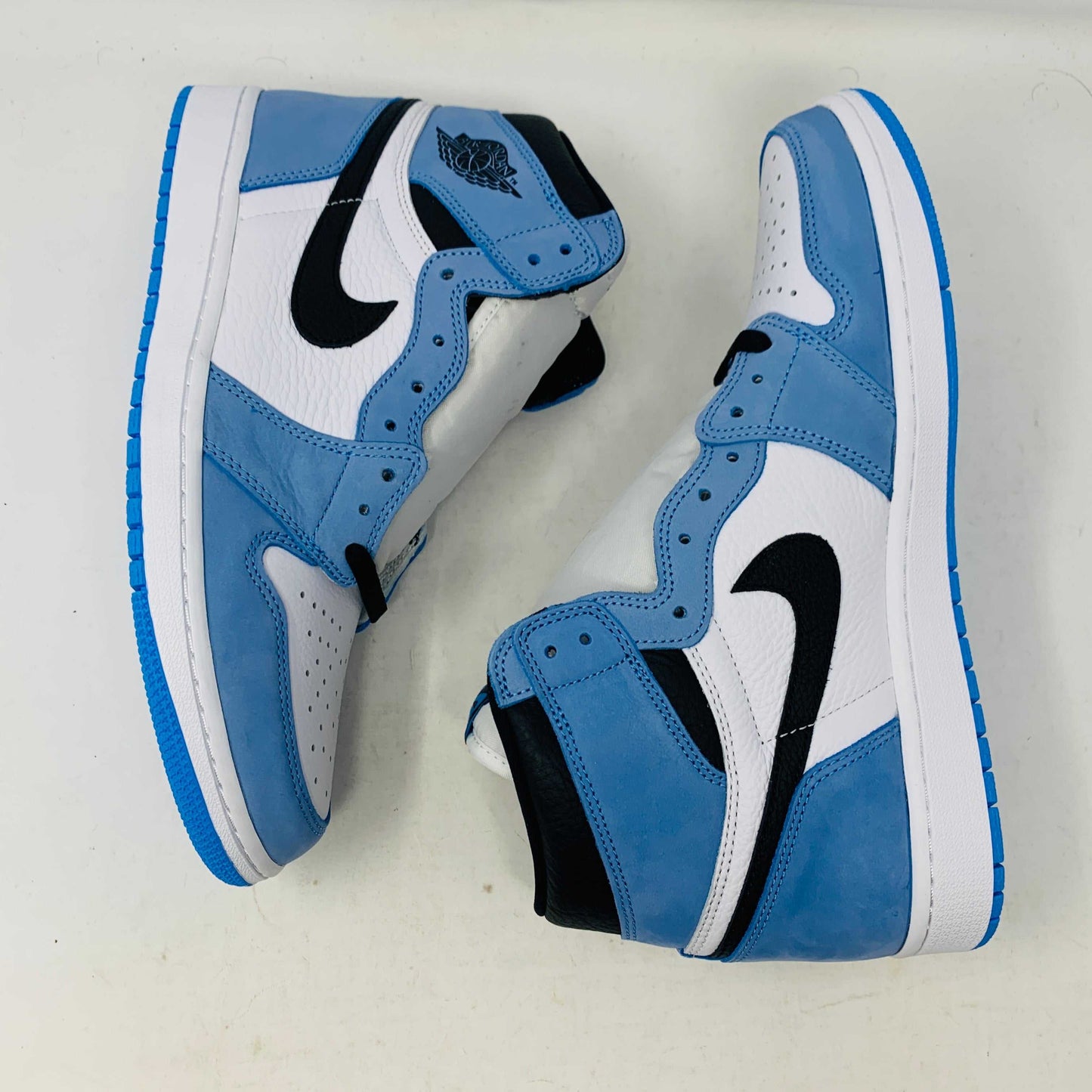 Jordan 1 University Blue sneakers with extra blue laces, brand new condition.