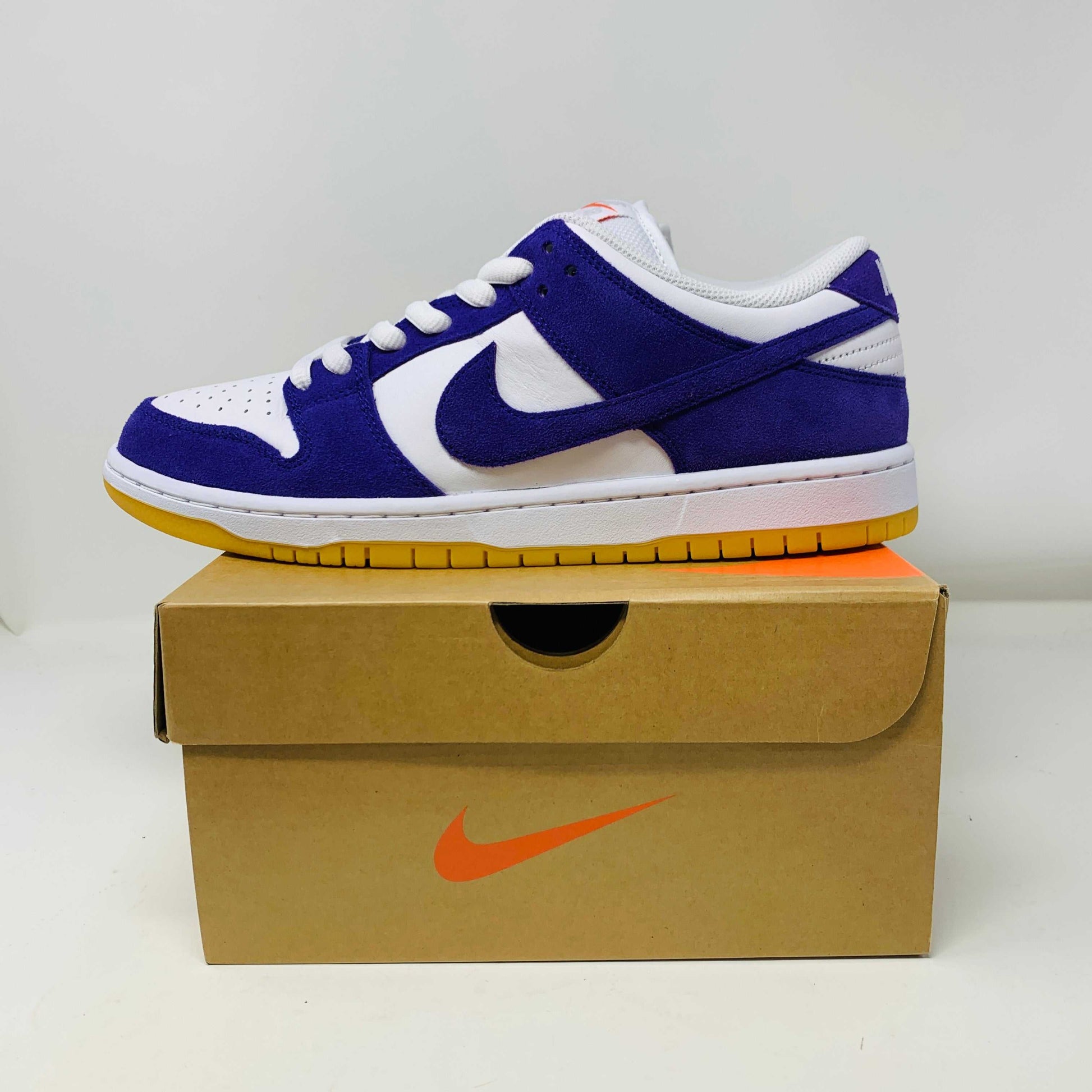 Nike SB Dunk Low Pro ISO Orange Label Court Purple sneaker on box.