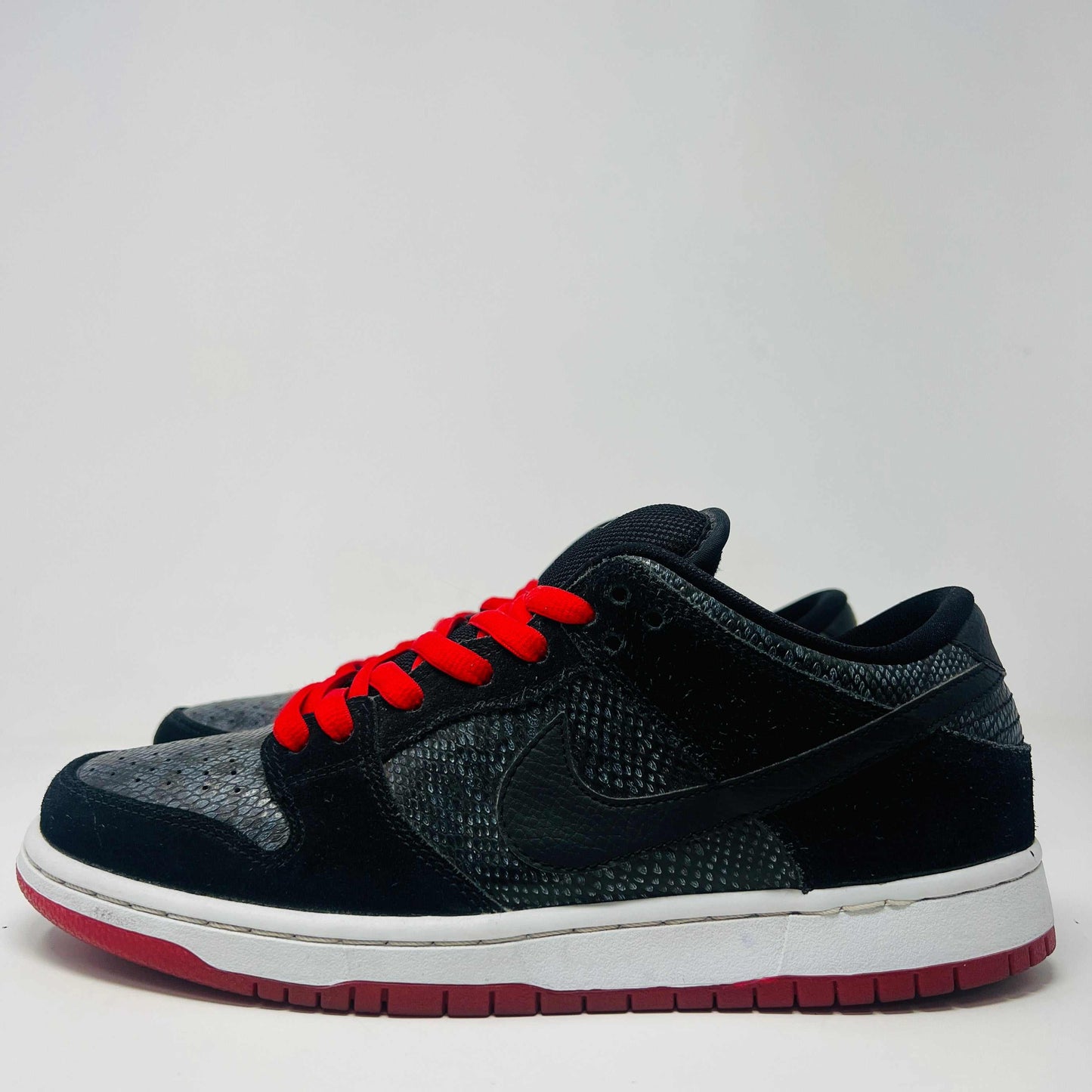 Nike SB Dunk Low Snake Eyes size 9, used condition, red laces, 2014 release.