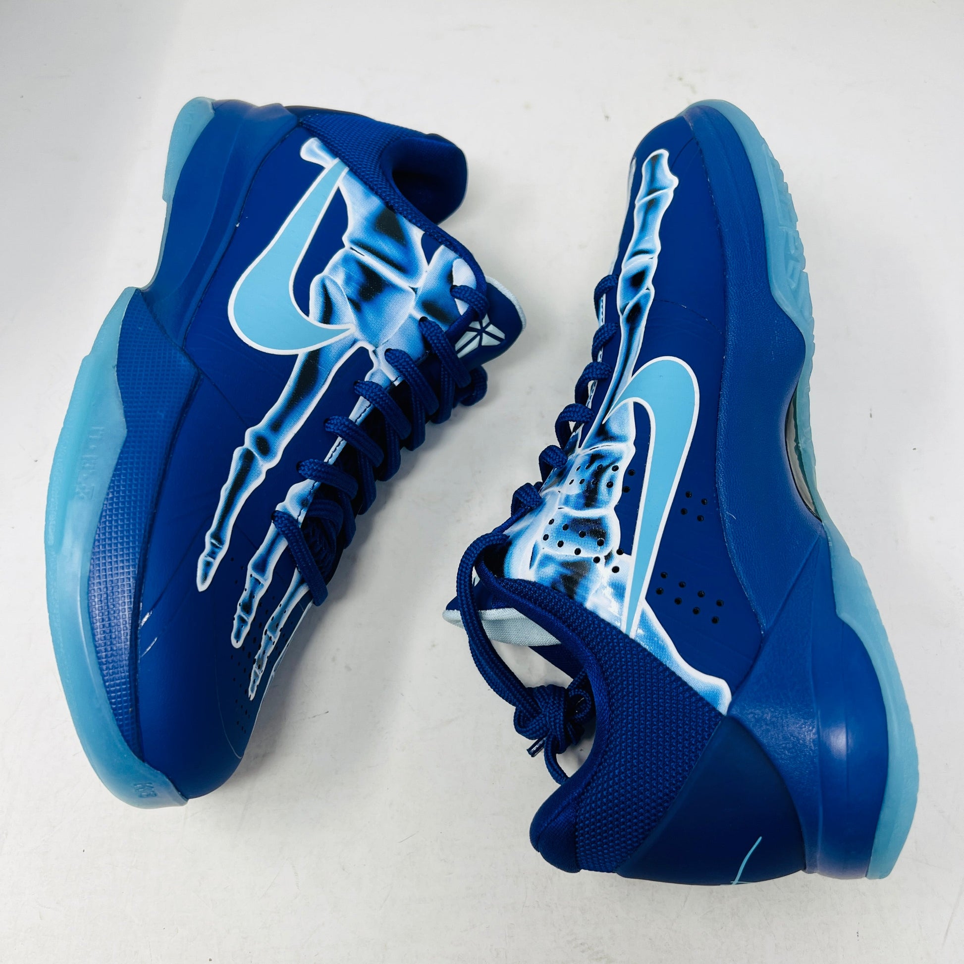 Nike Kobe 5 X-Ray sneakers in blue with skeletal design.