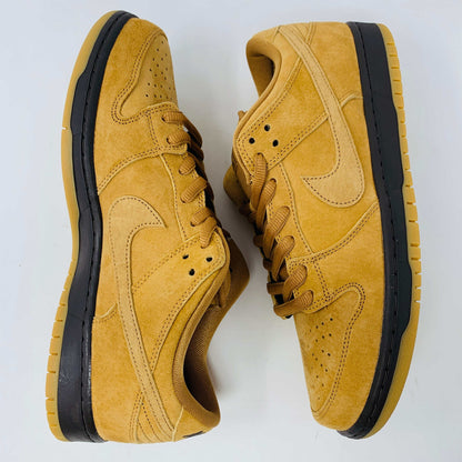 Nike SB Dunk Low Wheat 2021/2023 sneakers in wheat-colored suede with classic low-top design and white midsole.