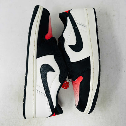 Authentic, brand new Jordan 1 Retro Low OG PSG Paris Saint-Germain sneakers by Jordan are displayed on a matching shoebox. The shoes feature a textured black swoosh and striking red toebox against a plain white background.