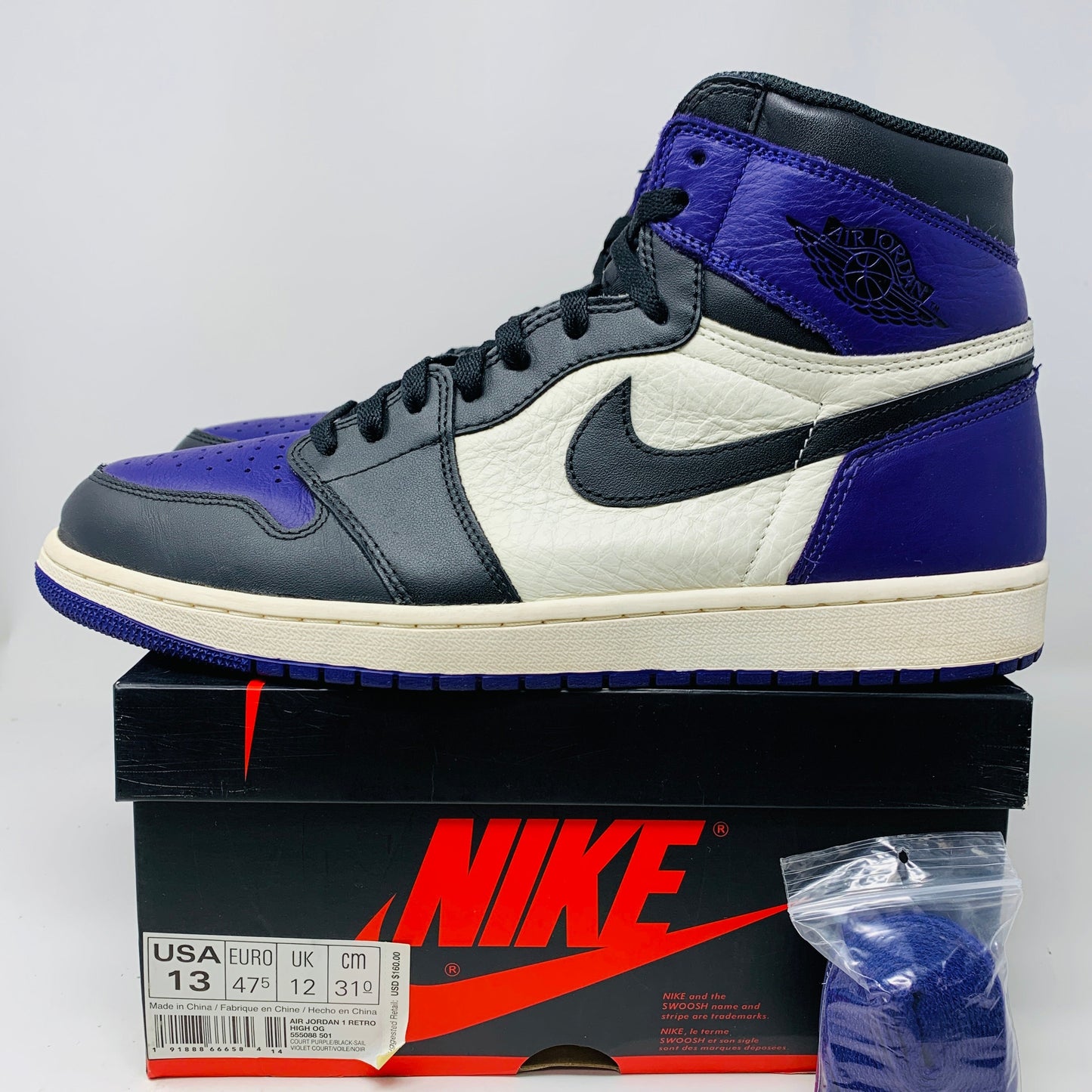 Jordan 1 Retro High Court Purple sneakers size 13 with box and purple laces, condition 8.5/10, 2018 release.