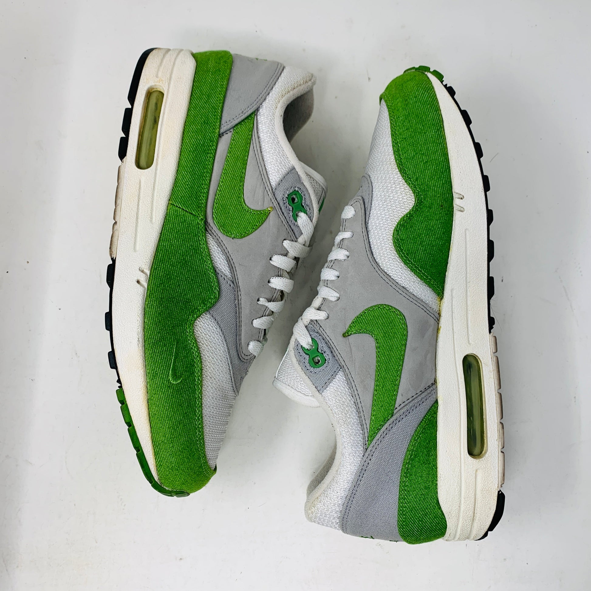 Nike Air Max 1 Patta 5th Anniversary Chlorophyll sneakers, size 10.5M; white, grey, and green colorway with vintage wear.