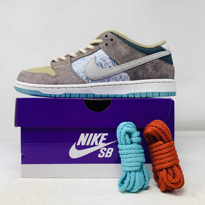 Nike SB Dunk Low Big Money Savings sneakers with extra laces on a purple box.