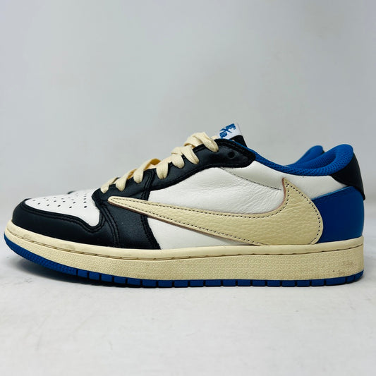 The Jordan 1 Retro Low OG SP Fragment x Travis Scott features a cream and black upper, blue heel and collar, and a cream sole with a signature swoosh design. Displayed against a plain backdrop without a box, it includes extra laces for versatility.