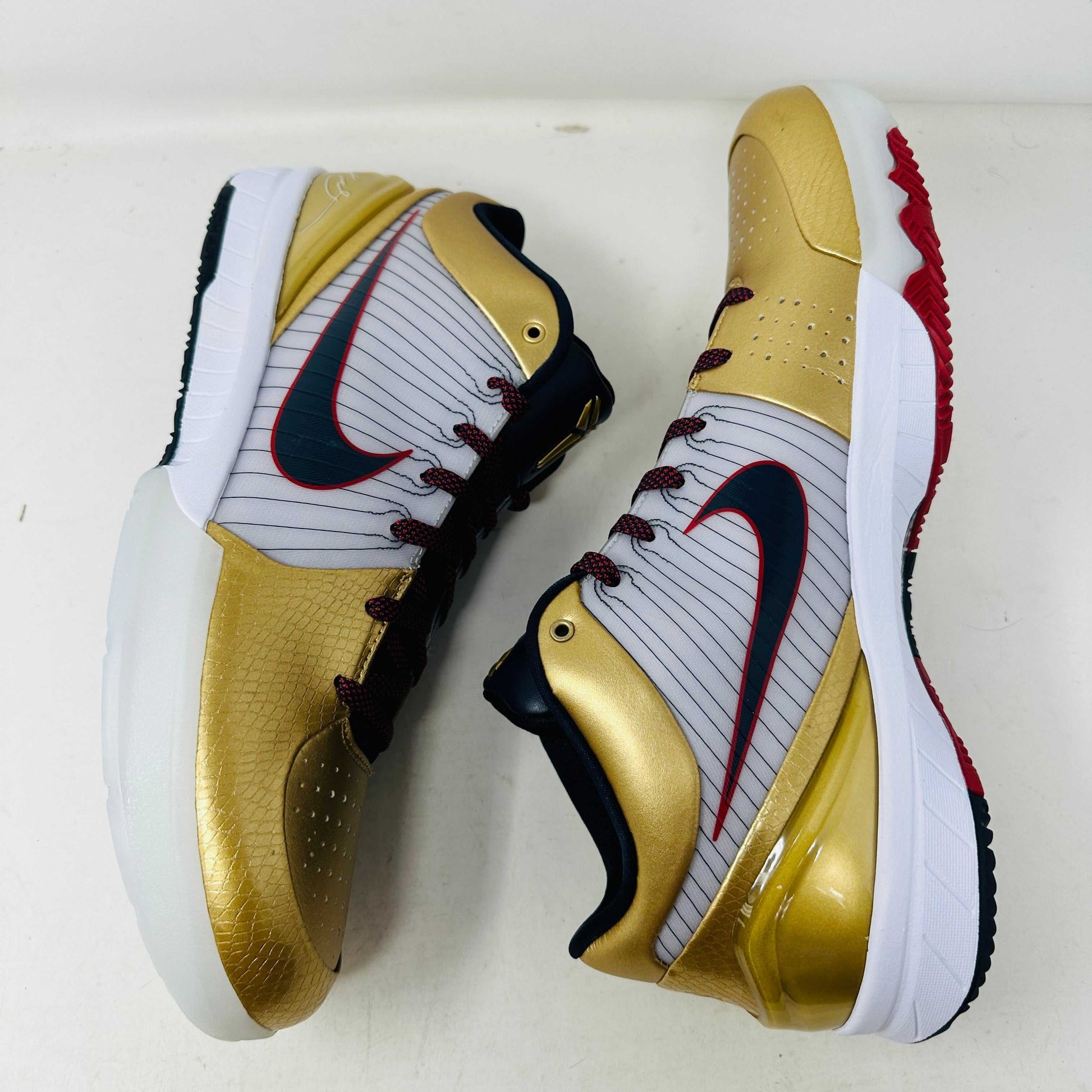 Nike Kobe 4 Protro Gold Medal 2024 basketball shoes, gold and black colorway, side view.