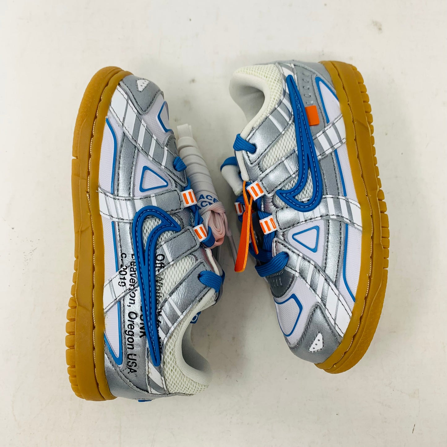 Nike Air Rubber Dunk Off-White University Blue TD with rubber sole and Off-White logo.