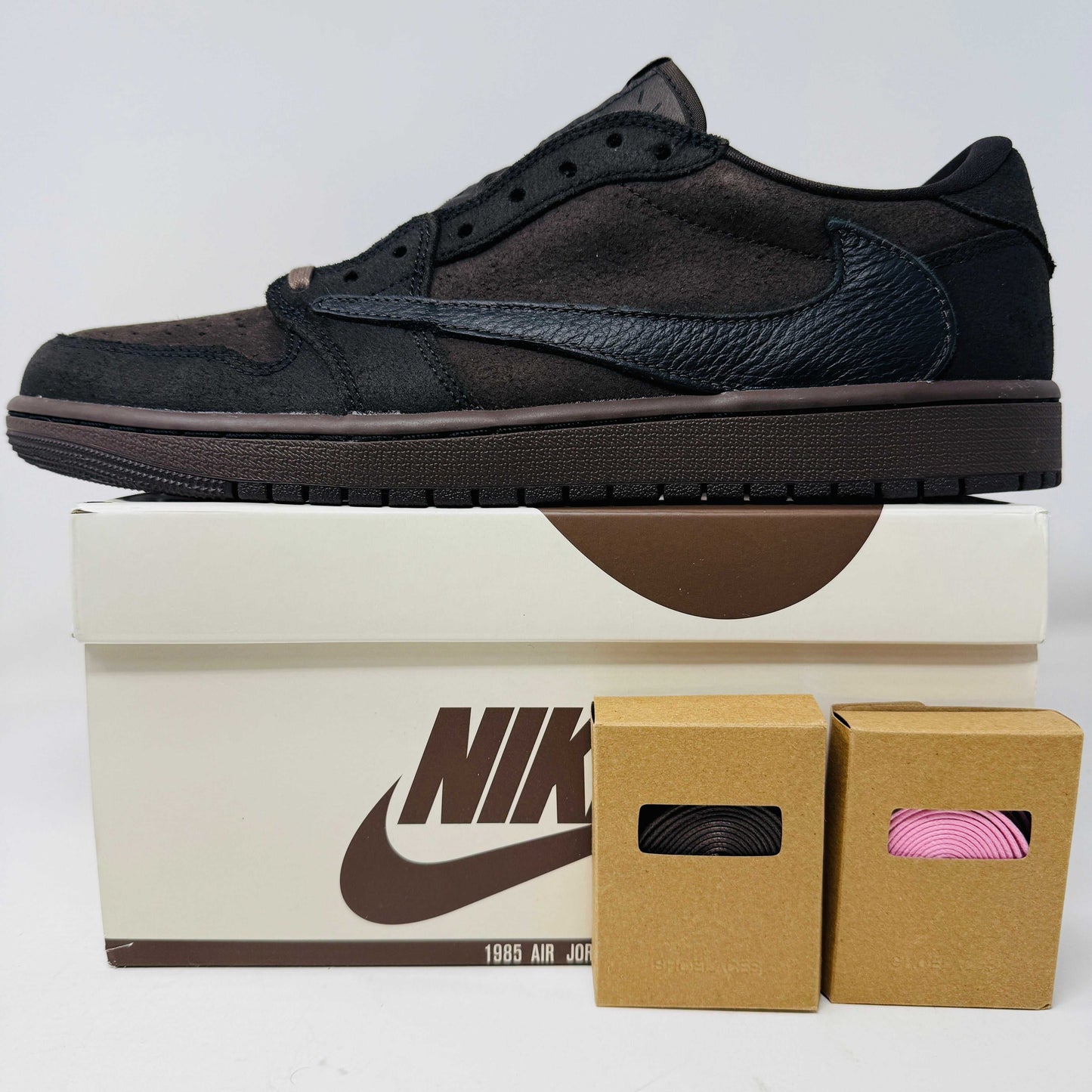 Jordan 1 Retro Low OG SP Travis Scott Velvet Brown sneakers with original box and extra laces.