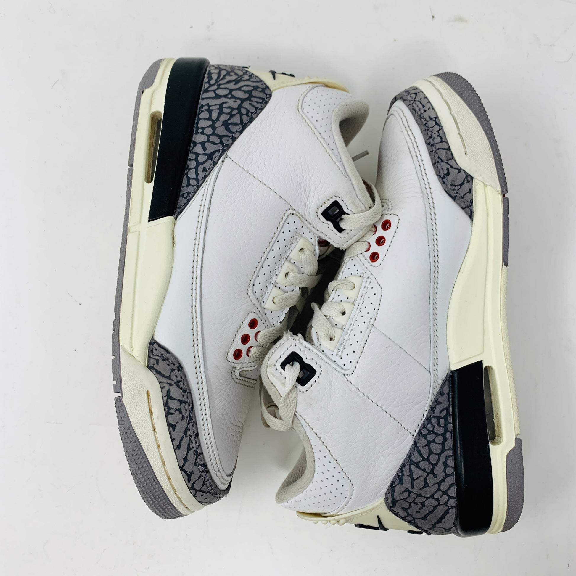 Jordan 3 Retro White Cement Reimagined (GS) sneakers, size 3.5Y, 2023 edition, showing clean uppers and some sole wear.