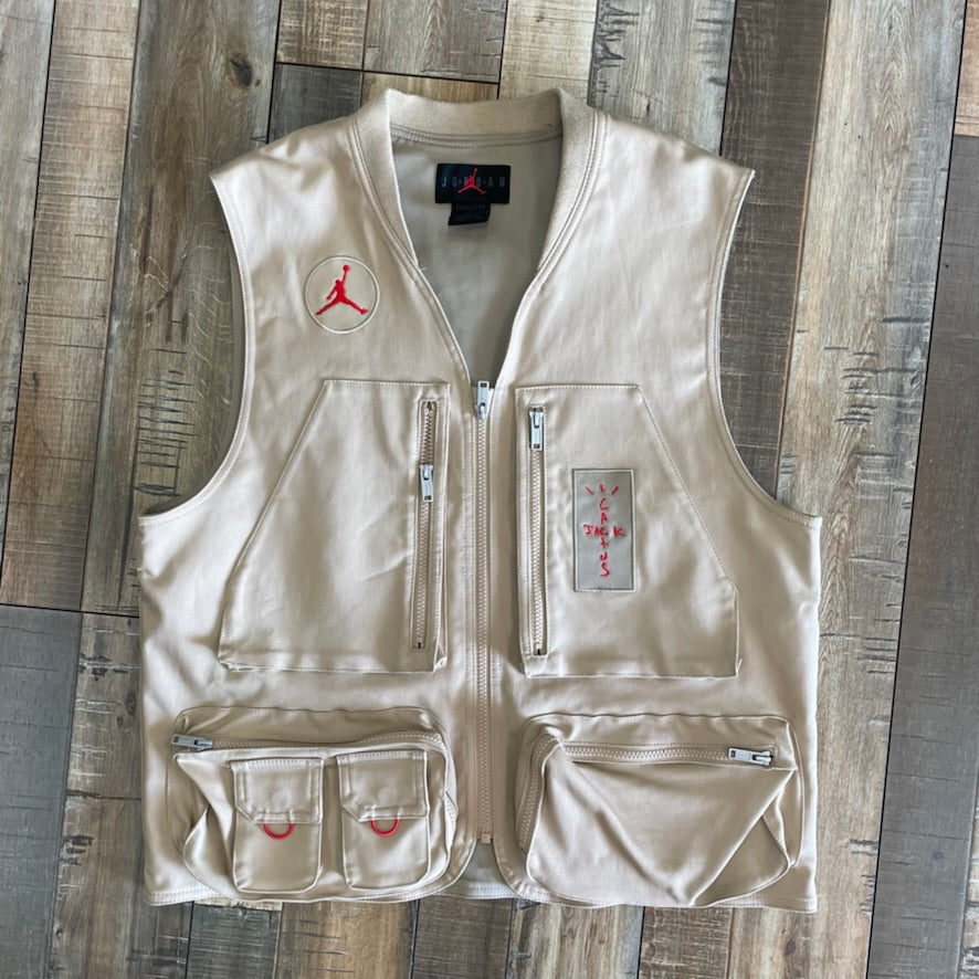 Travis Scott Cactus Jack x Jordan Utility Vest in Desert Khaki with University Red accents, brand new condition.