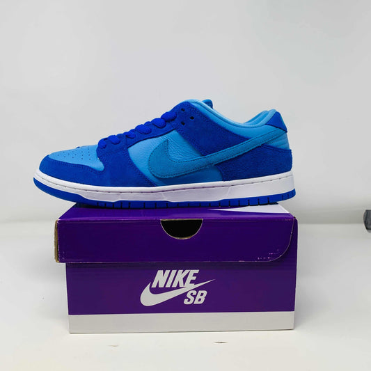 Nike SB Dunk Low Blue Raspberry sneakers with blue laces, displayed on a purple Nike SB box, brand new, 2022 edition.