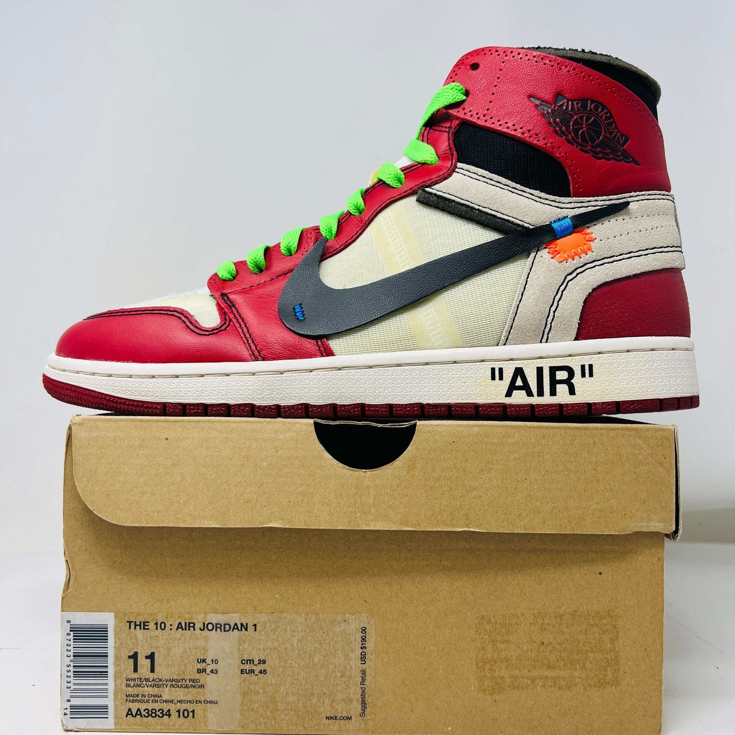 Jordan 1 Retro High Off-White Chicago sneaker on box, red and white colorway with Off-White branding.