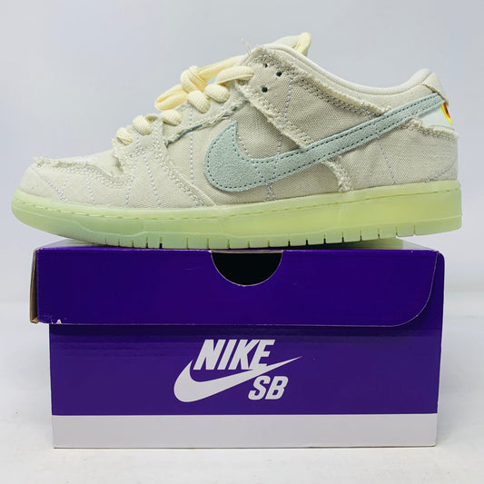 Nike SB Dunk Low Mummy sneaker with extra green laces on a purple box, 2021 model.