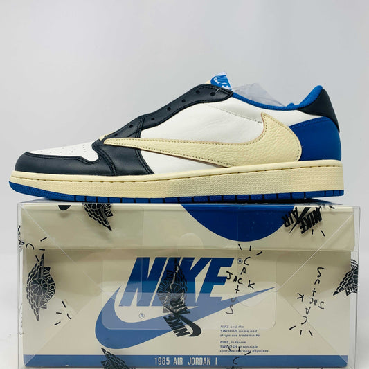 The Jordan 1 Low Travis Scott x Fragment sneakers feature a black and white leather upper with blue accents, a unique beige backward swoosh, and come in a branded Nike box with graphics. These brand-new shoes include an extra set of laces for added versatility.