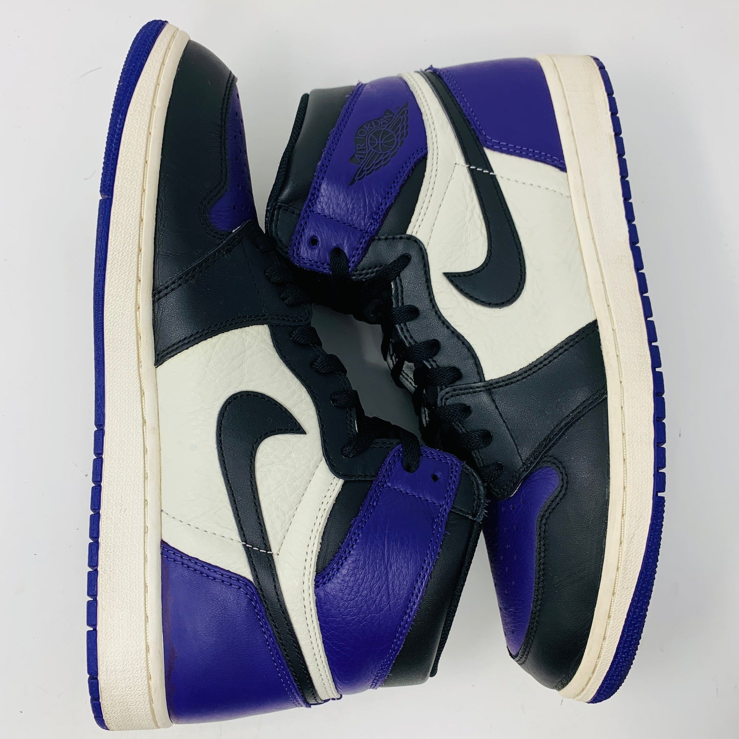 Jordan 1 Retro High Court Purple sneakers, size 13, clean condition with purple laces, 2018 model.