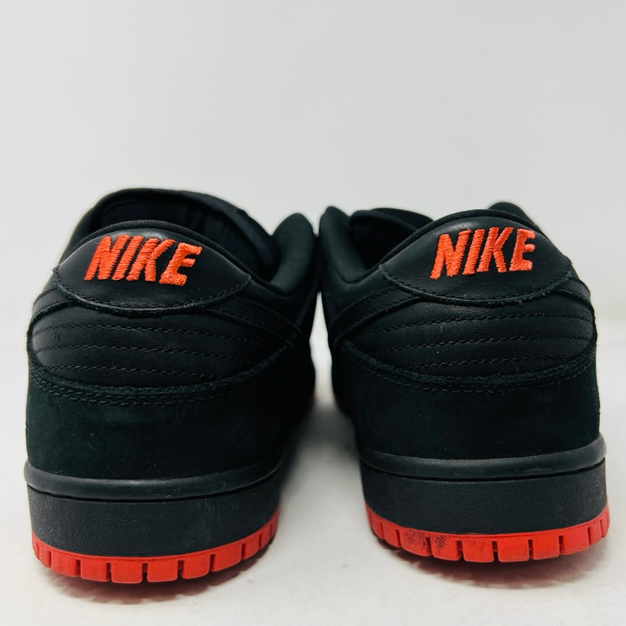 Nike SB Dunk Low Black Pigeon sneakers, iconic black design with pigeon logo.