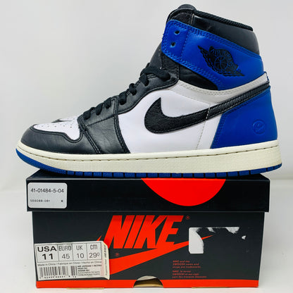 Jordan 1 Retro High Fragment sneaker on a Nike box with black, white, and blue color scheme.