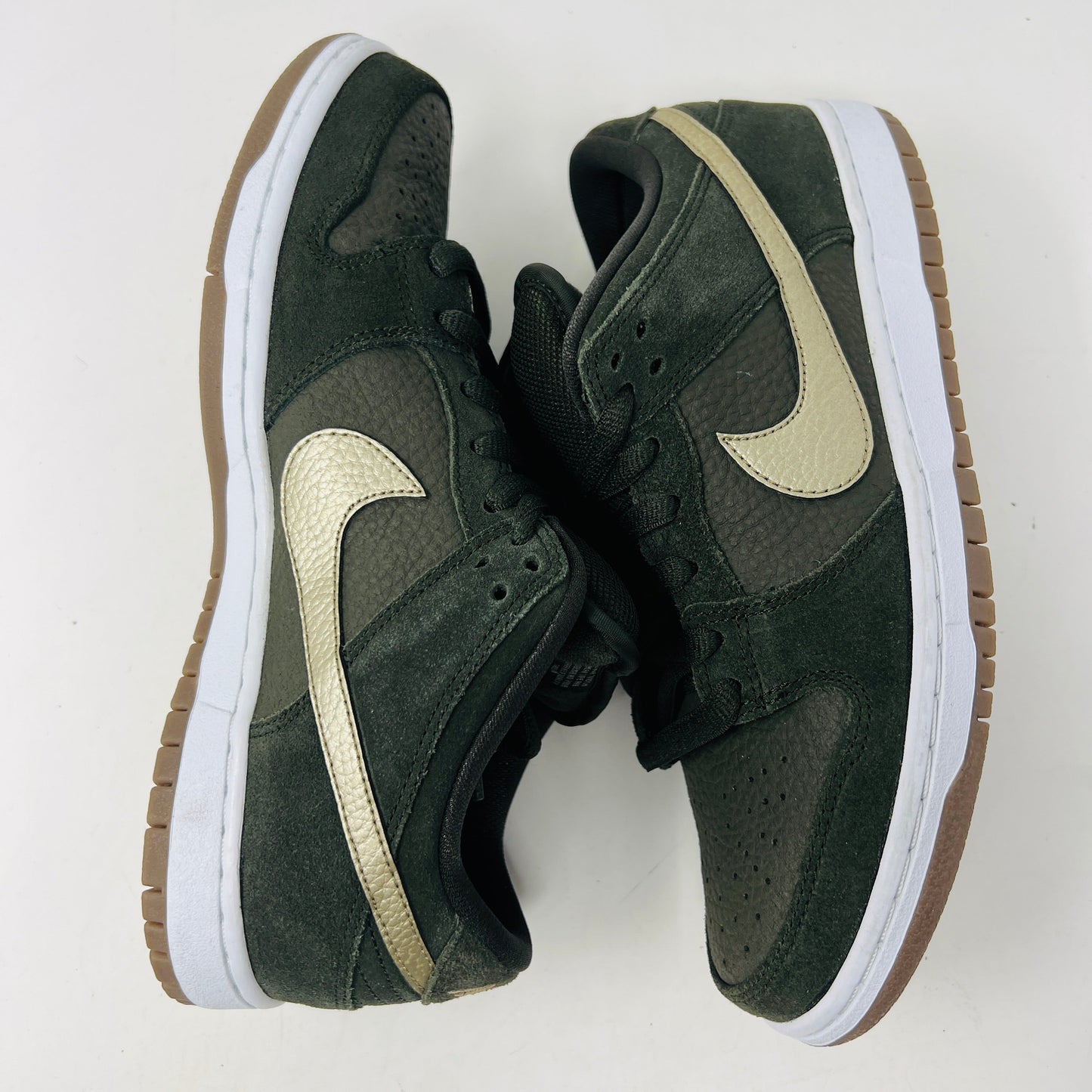 A pair of Nike SB Dunk Low Sequoia White Gum shoes, dark green with light tan swooshes and brown soles, set against a white background. 100% authentic.