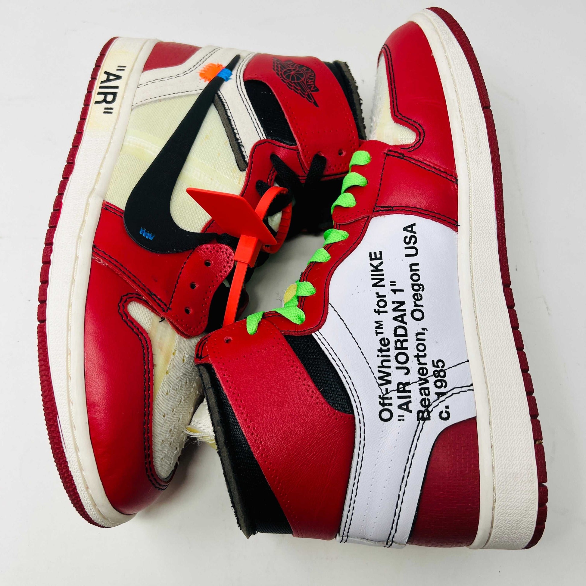 Jordan 1 Retro High Off-White Chicago sneakers with red and white colorway and Off-White branding.