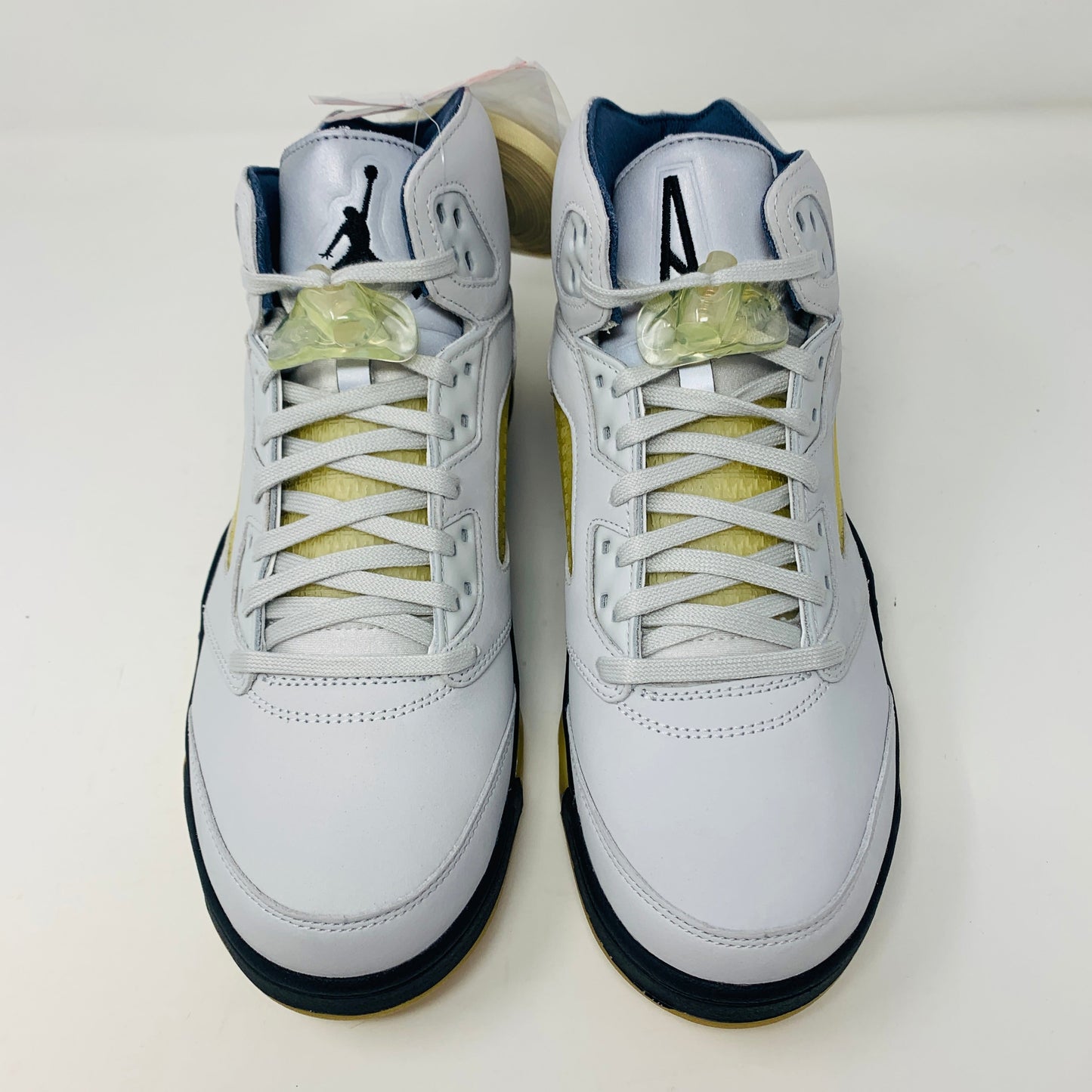 Jordan 5 Retro A Ma Maniére Dawn Women's sneakers in white, black, and gold with iconic Jordan logo.