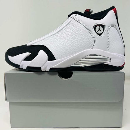 Jordan 14 Retro Black Toe (2024) sneaker with black, white, and red premium leather design, featuring Jumpman logo.