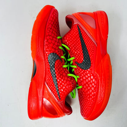 Nike Kobe 6 Protro Reverse Grinch sneakers in vibrant red with green laces.