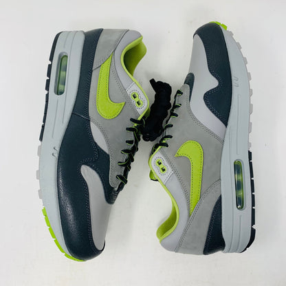 Nike Air Max 1 SP HUF Pear Green 2024 sneakers, brand new condition, with hang tag and laces visible.