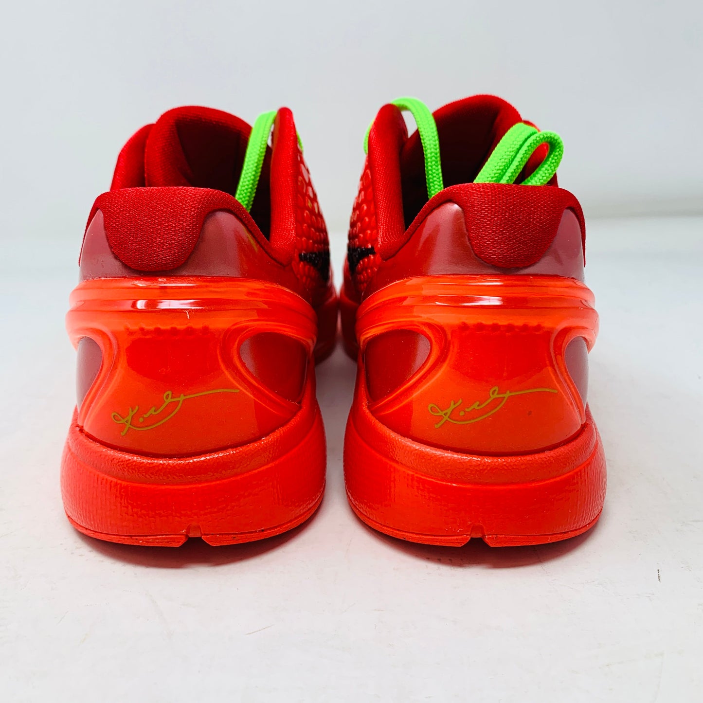 Nike Kobe 6 Protro Reverse Grinch GS basketball shoes, vibrant green and black colorway, Grinch-inspired design, rear view with signature detailing.