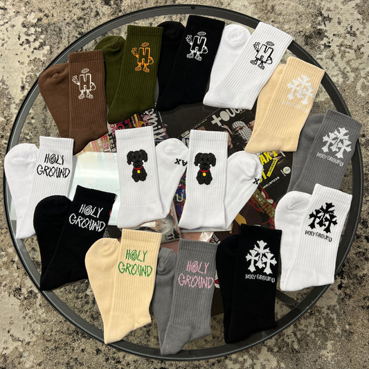 Colorful Holy Ground Socks arranged on a table for spiritual and everyday wear.